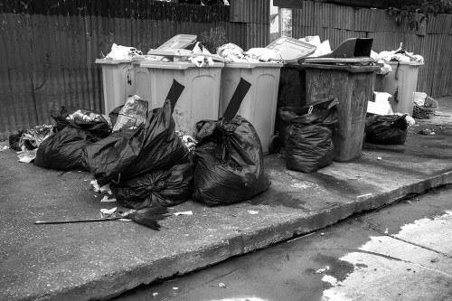 Construction site with waste clearance in Queens Park